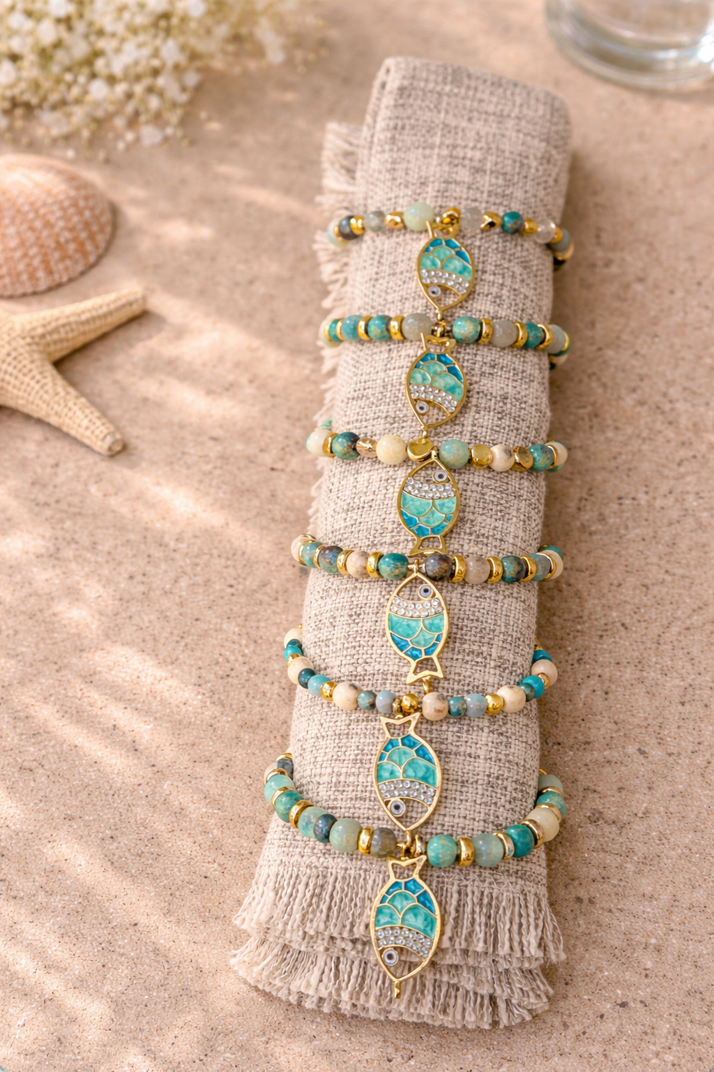 Set of 6 stunning beaded napkin rings with turquoise and golden tones and fish pendants that make your table incredibly chic