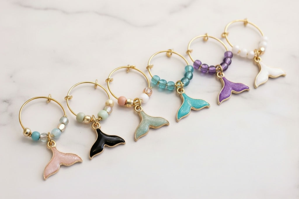 Dolphin Cove wine glass charms styled on wine glass handmade in Israel close-up