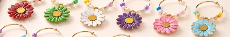 Handmade floral wine charms and napkin rings collection displayed in gift box