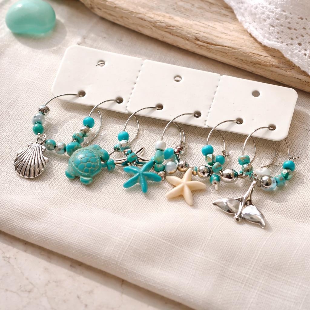 Ocean whisper wine charms styled on tablecloth sea themed set of 6