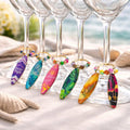  colorful surfboard wine glass charms with matching beads on gold toned hoops. Set of 6