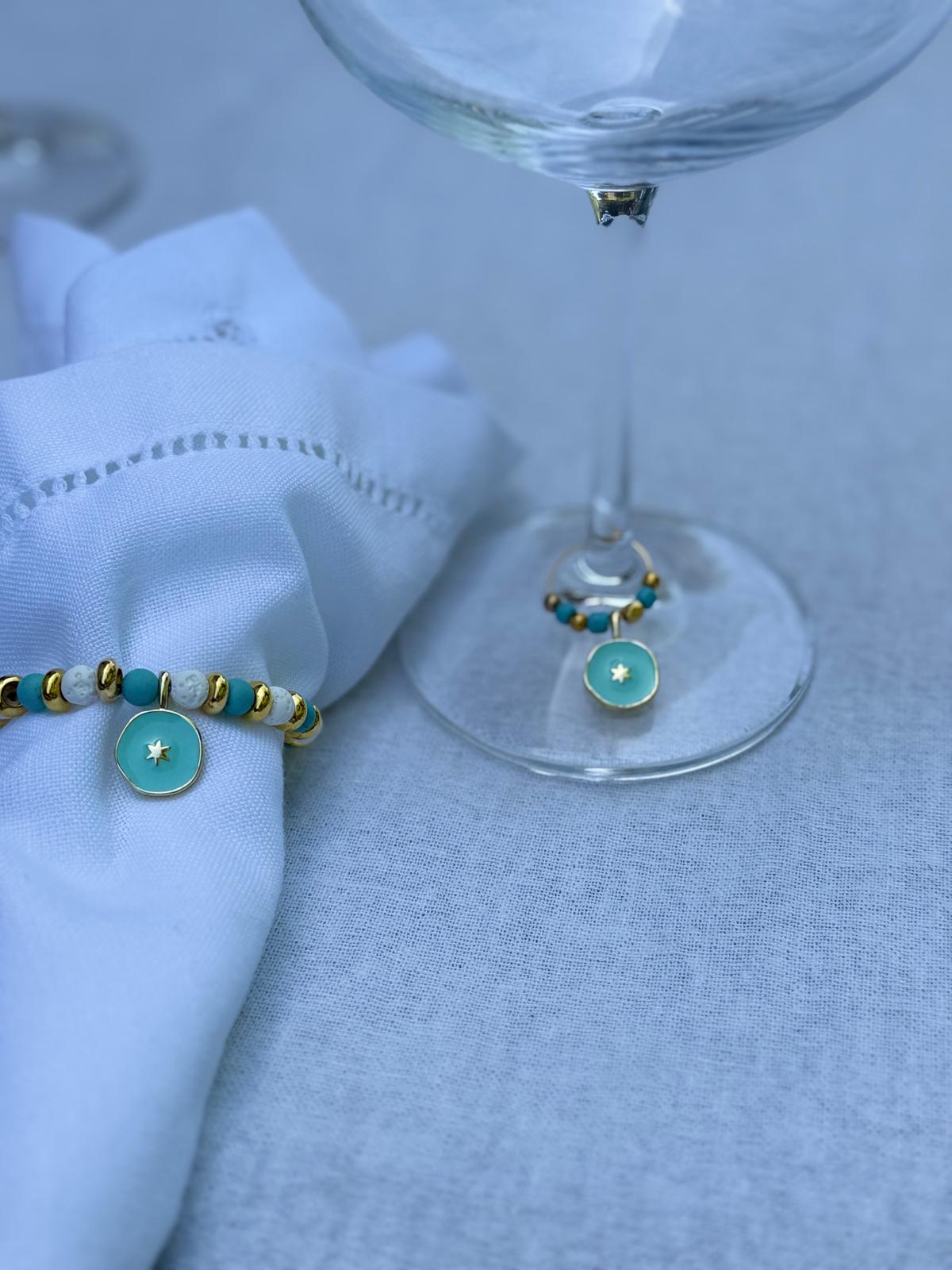 Turquoise and gold beaded napkin rings with star charms on elegant neutral table setting by the pool, Mediterranean coastal table decor, set of 6 by My Charmed Life