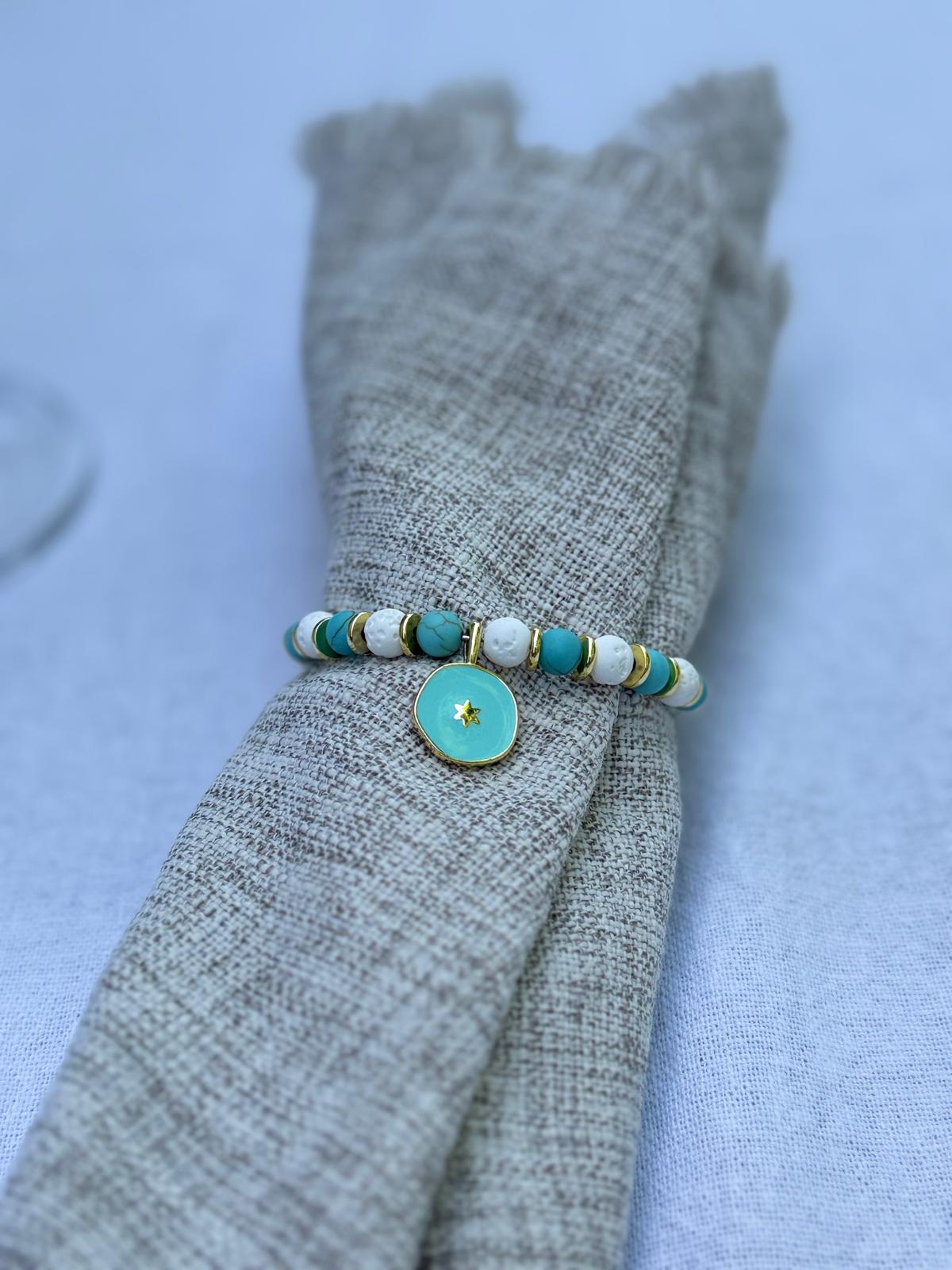 Turquoise and gold beaded napkin rings with star charms on elegant neutral table setting by the pool, Mediterranean coastal table decor, set of 6 by My Charmed Life