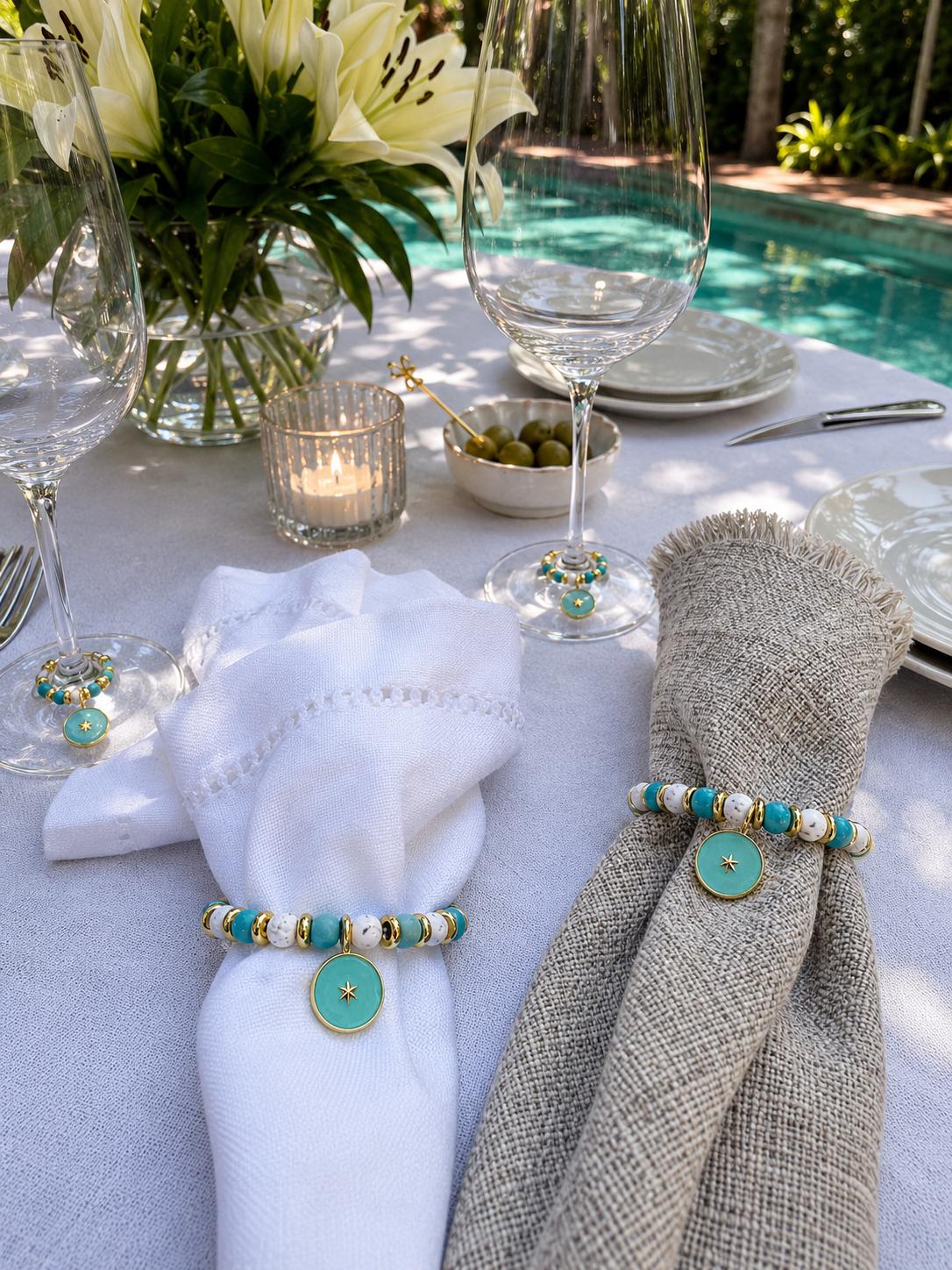 Turquoise and gold beaded napkin rings with star charms on elegant neutral table setting by the pool, Mediterranean coastal table decor, set of 6 by My Charmed Life