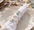 White napkin rings with silver sea charms ocean pendants set of 6